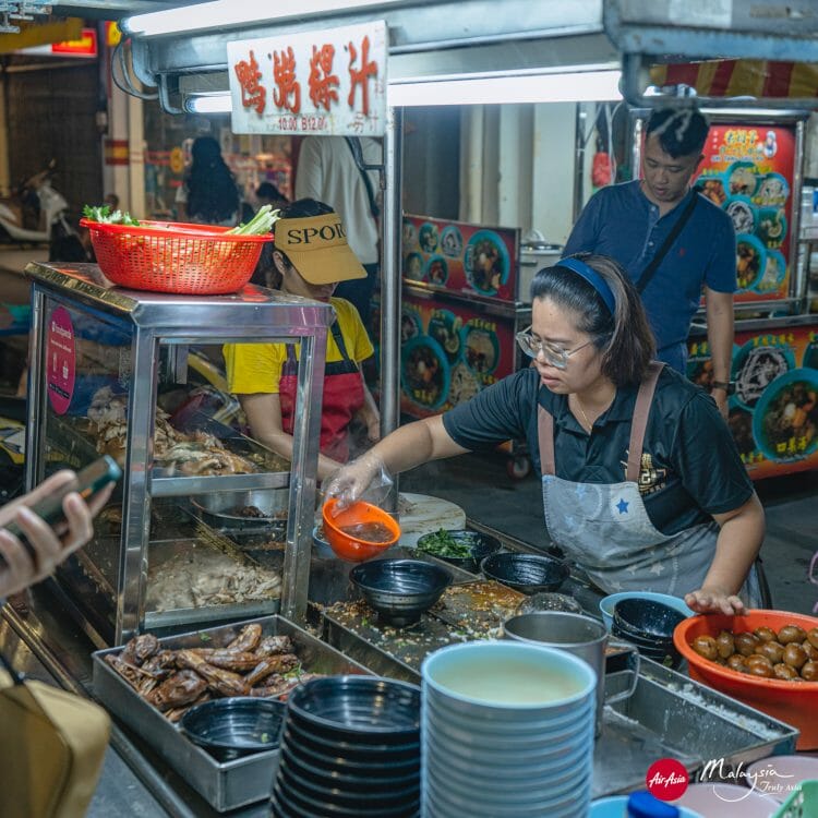 Kimberley Street duck kway chap, George Town, Pinang, Malaysia
