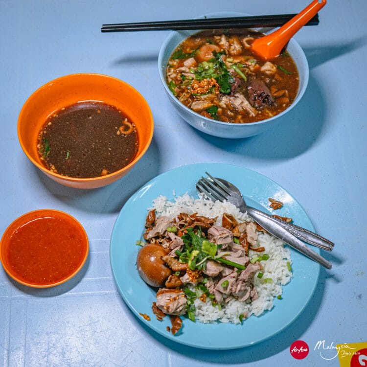 Kimberley Street duck kway chap, George Town, Pinang, Malaysia