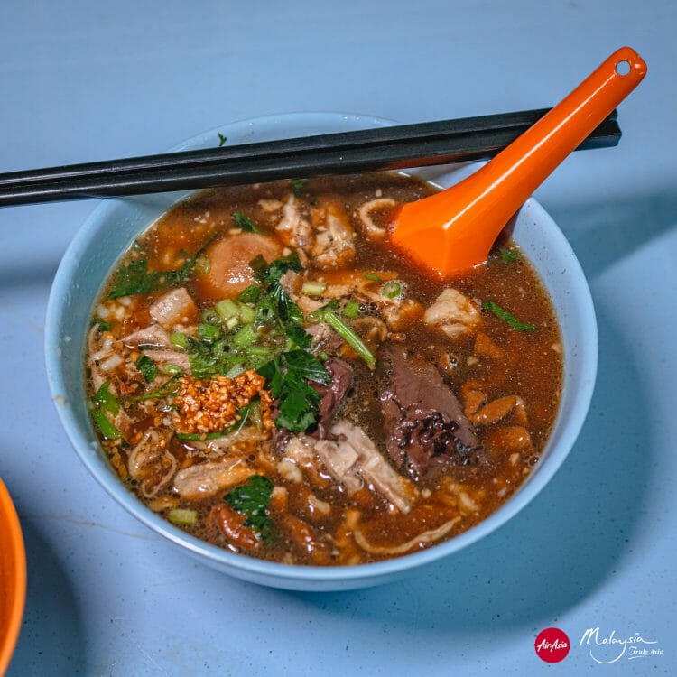 Kimberley Street duck kway chap, George Town, Pinang, Malaysia