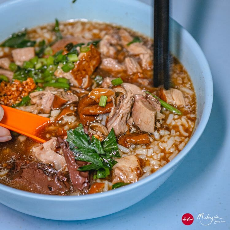 Kimberley Street duck kway chap, George Town, Pinang, Malaysia