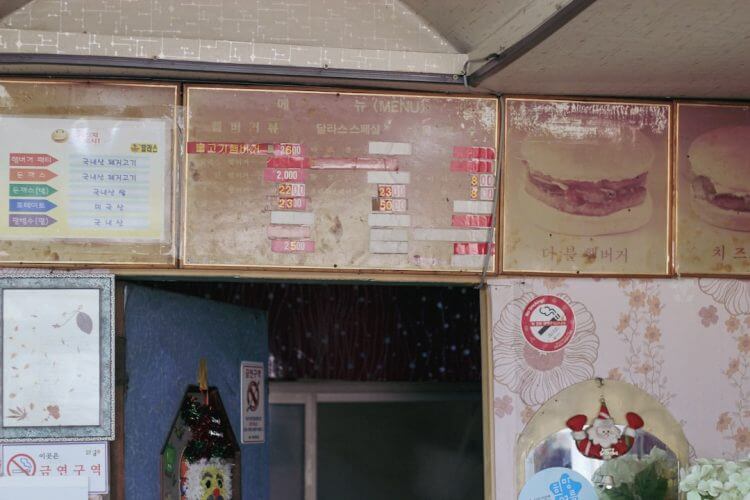 A menu board with food items and pictures