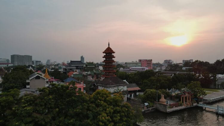 a city with a river and a tower