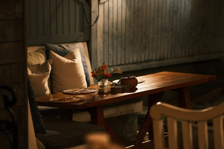 A cozy outdoor dining table is set.