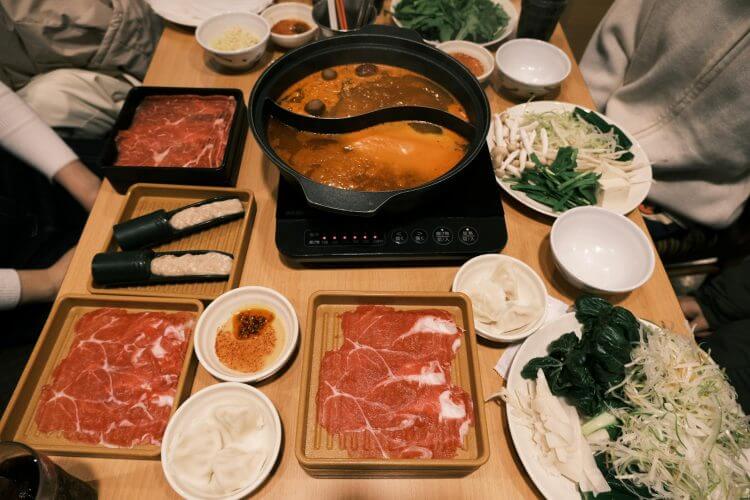 Savor a classic Japanese hotpot meal with fresh ingredients in Toyohashi, Japan.