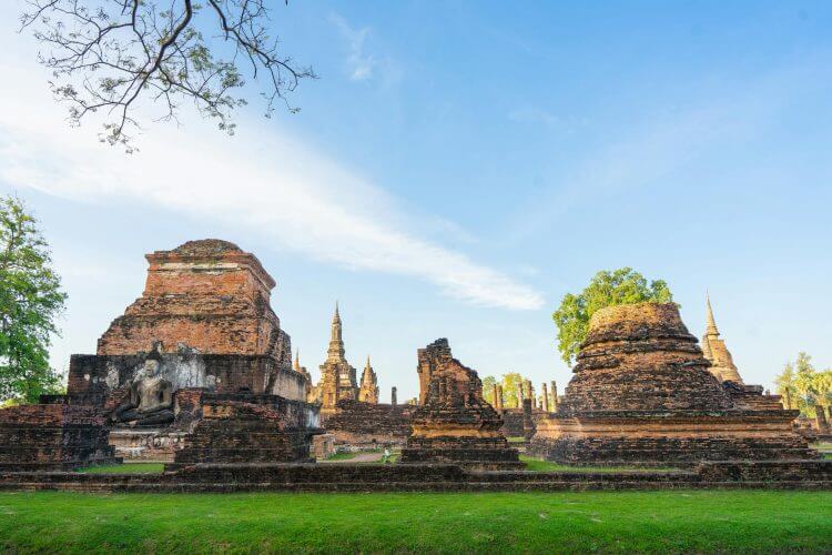 Explore the ancient ruins at a historical temple site under a clear blue sky.