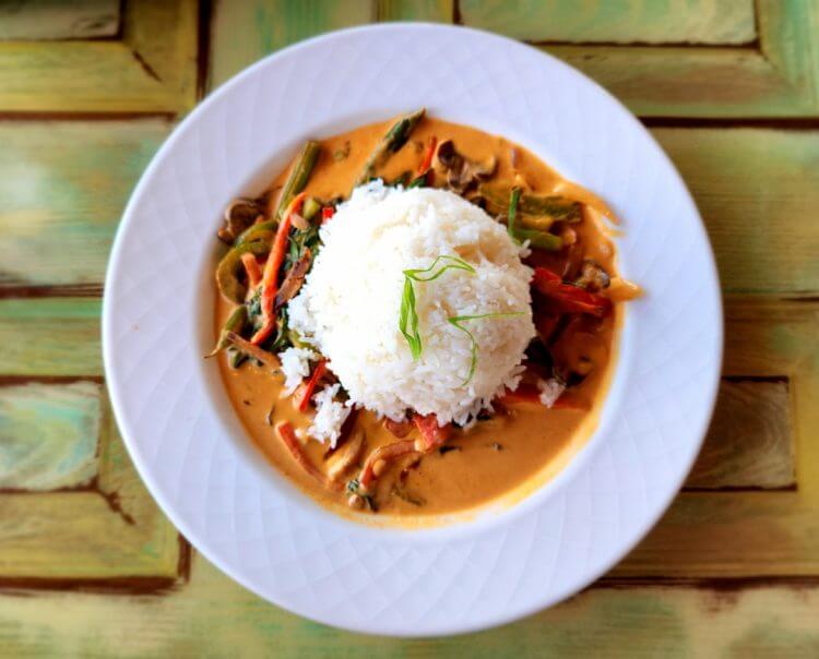 A plate of food on a wooden table