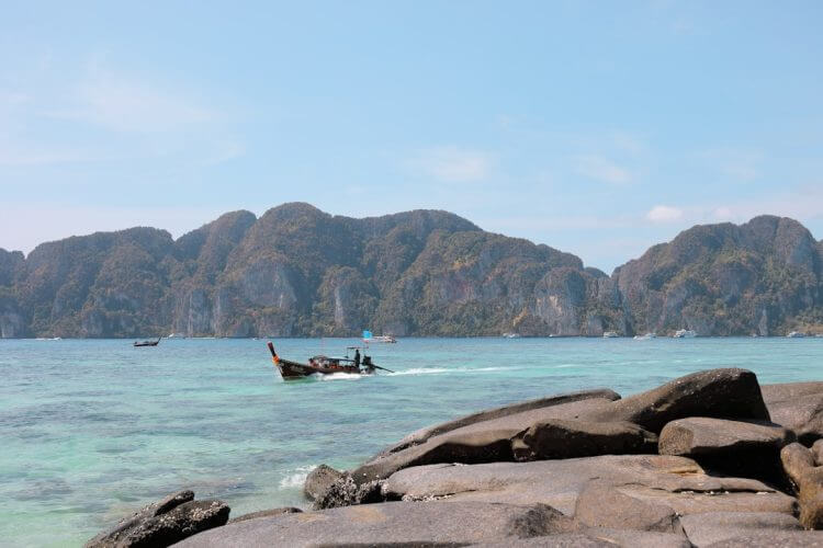 black boat near mountains