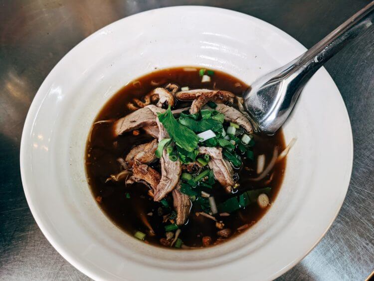 a bowl of soup with a spoon