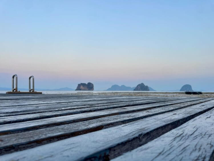 Wooden deck overlooking islands at sunrise