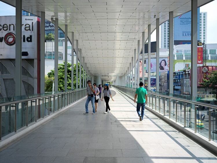 Pedestrians use a contemporary skywalk near CentralWorld in Bangkok, Thailand.